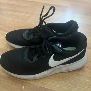Women’s black Nike sneakers